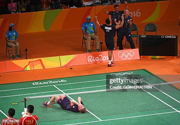 Great Britain's Marcus Ellis and Great Britain's Chris Langridge celebrate after winning against China's Chai Biao and China's Hong Wei during their...