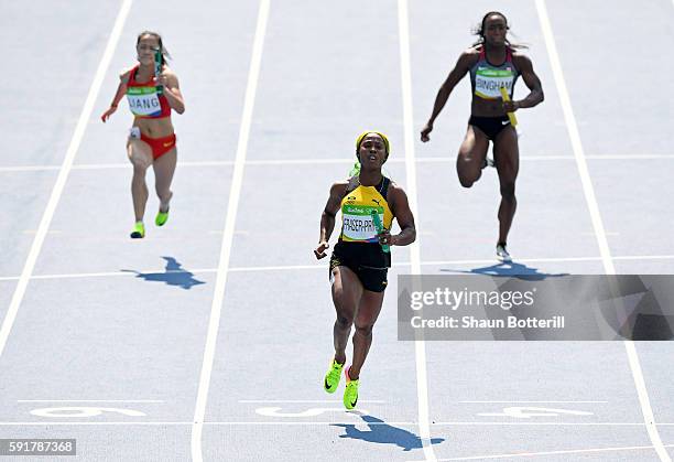 Shelly-Ann Fraser-Pryce of Jamaica leads heat one during round one of the Women's 4 x 100m Relay on Day 13 of the Rio 2016 Olympic Games at the...