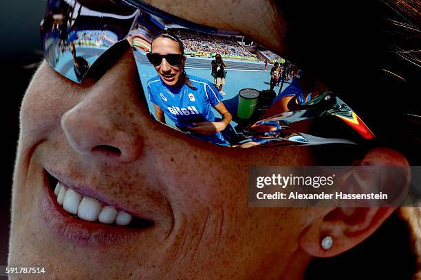 Alessia Trost of Italy is reflected in the glasses of Ruth Beitia of Spain during Women's High Jump Qualifying on Day 13 of the Rio 2016 Olympic...