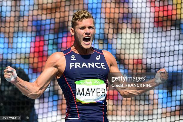 France's Kevin Mayer reacts in the Men's Decathlon Discus Throw during the athletics event at the Rio 2016 Olympic Games at the Olympic Stadium in...