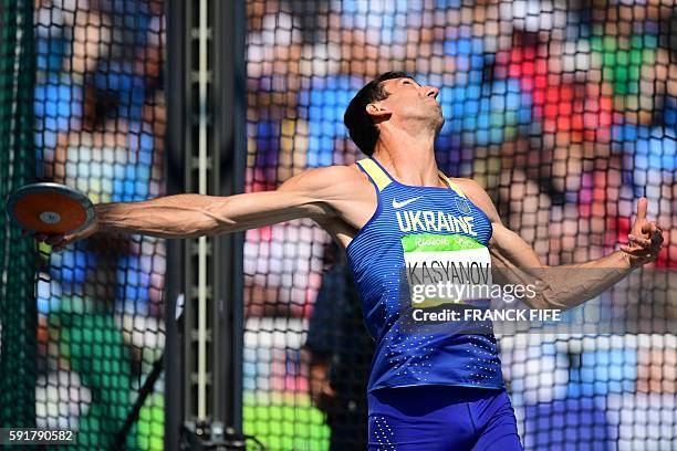 Ukraine's Oleksiy Kasyanov competes in the Men's Decathlon Discus Throw during the athletics event at the Rio 2016 Olympic Games at the Olympic...