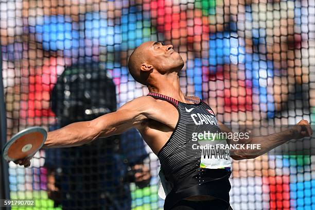 Canada's Damian Warner competes in the Men's Decathlon Discus Throw during the athletics event at the Rio 2016 Olympic Games at the Olympic Stadium...