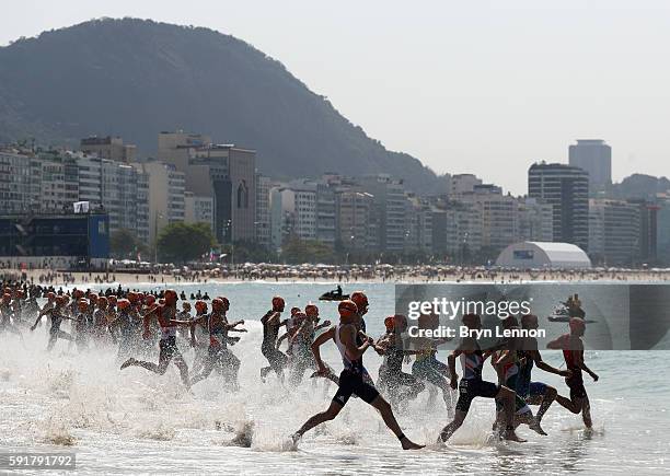 Competitors take to the water during the Men's Triathlon at Fort Copacabana on Day 13 of the 2016 Rio Olympic Games on August 18, 2016 in Rio de...