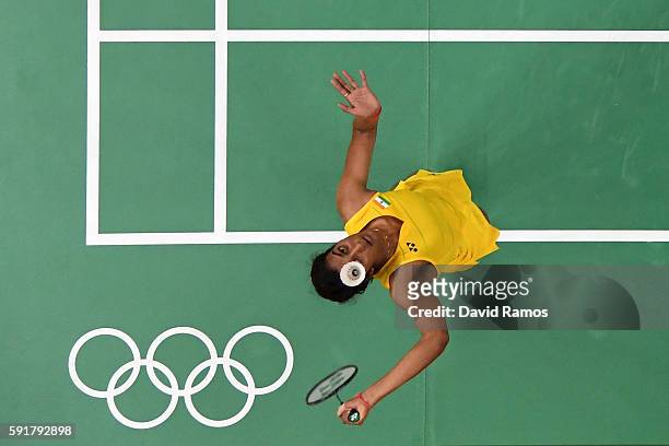 Pusarla V Sindhu of India plays a shot during the Women's Badminton Singles Semi-final against Nozomi Okuhara of Japan on Day 13 of the Rio 2016...