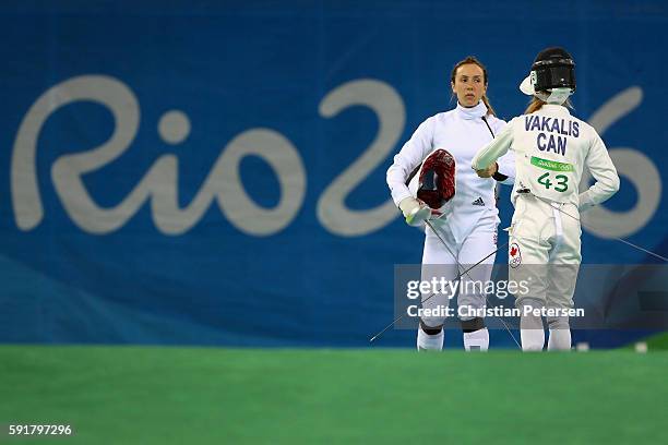 Kate French of Great Britain duels with Donna Vakalis of Canada during the Modern Pentathlon Womens Fencing: classification round on Day 13 of the...