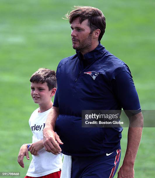 New England Patriots quarterback Tom Brady with his son, John Edward Thomas Moynahan, after today's joint practice with the Chicago Bears. The New...