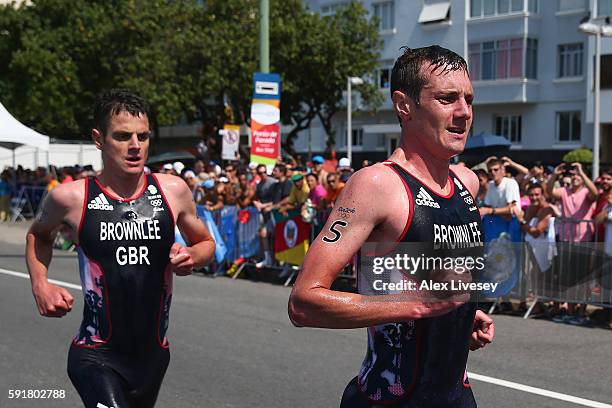 Alistair Brownlee and Jonathan Brownlee of Great Britain compete during the Men's Triathlon at Fort Copacabana on Day 13 of the 2016 Rio Olympic...