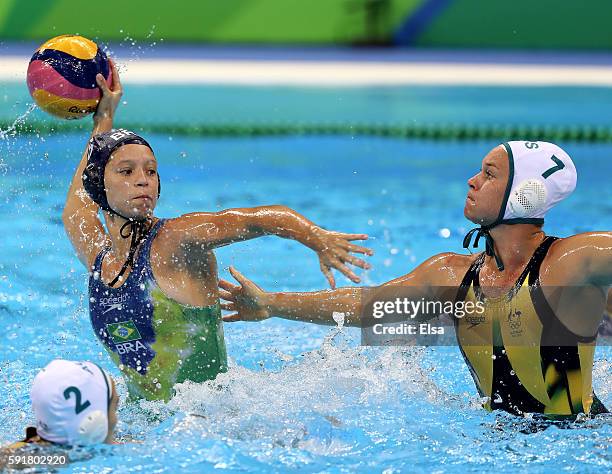 Izabella Chiappini of Brazil looks to pass as Rowie Webster of Australia defends during the Women's Water Polo at Olympic Aquatics Stadium on August...