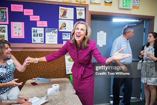 Katie McGinty, Democratic candidate for Pennsylvania Senate, talks with guests during the Annual Penn Ag Democrat Barbeque at the Ferguson Township...