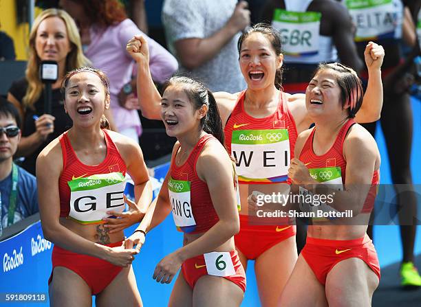 Qiqi Yuan, Yongli Wei, Manqi Ge and Xiaojing Liang of China react during round one of the Women's 4 x 100m Relay on Day 13 of the Rio 2016 Olympic...