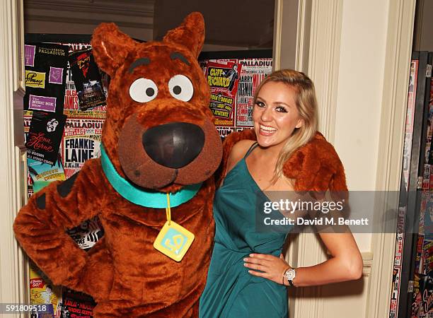 Larissa Eddie poses with Scooby-Doo at the press night after party for "Scooby-Doo Live! Musical Mysteries" at The London Palladium on August 18,...