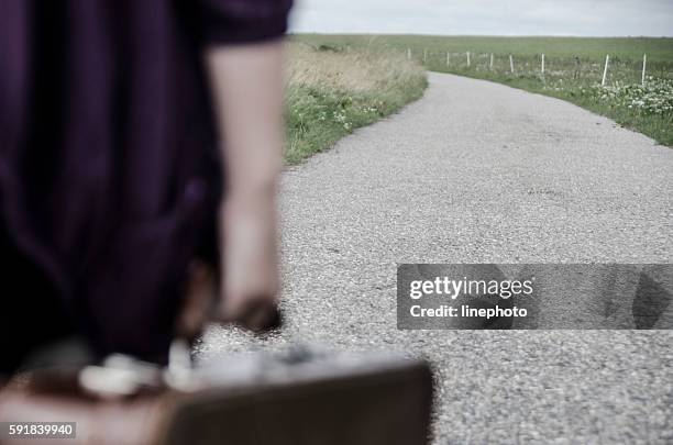 child goes on the road with her suitcase - leaving home stock pictures, royalty-free photos & images