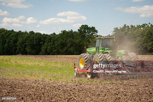 john deere planting crops - tractor ploughing field bildbanksfoton och bilder