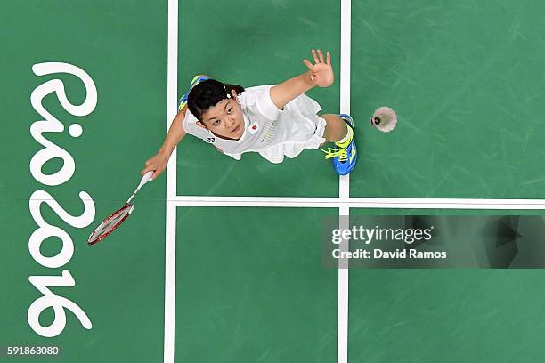 Ayaka Takahashi of Japan plays a shot against Christinna Pedersen and Kamilla Rytter Juhl of Denmark during the Women's Doubles Badminton Gold Medal...