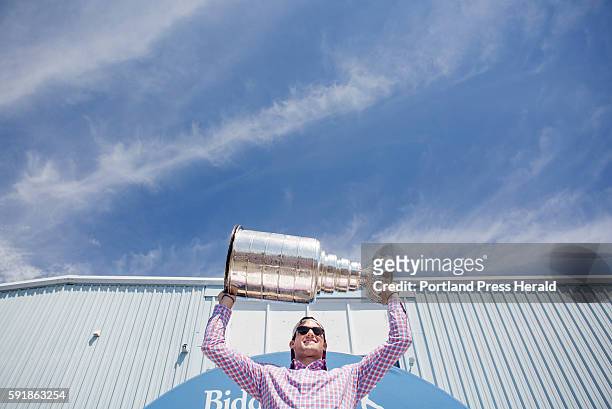 Brian Dumoulin with the 2016 the Stanley Cup outside of the Biddeford Arena, where he grew up playing hockey. Dumoulin is the first Maine native to...