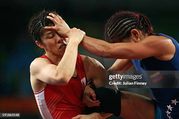 Saori Yoshida of Japan competes against Betzabeth Angeli Arguello Villegas of Venezuela during the Women's Freestyle 53 kg Semifinals match on Day 13...