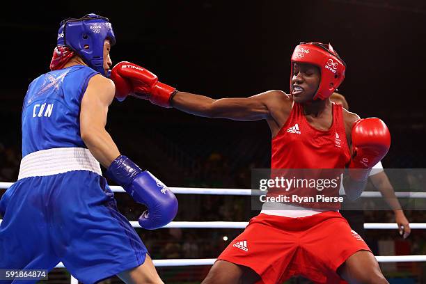 Nicola Adams of Great Britain fights against Cancan Ren of China during a Women's Fly Semifinal bout on Day 13 of the 2016 Rio Olympic Games at...