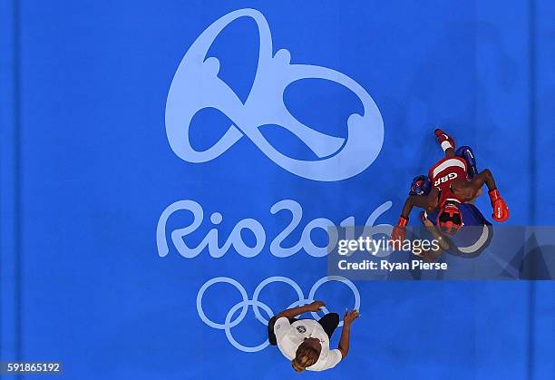 Nicola Adams of Great Britain fights against Cancan Ren of China during a Women's Fly Semifinal bout on Day 13 of the 2016 Rio Olympic Games at...