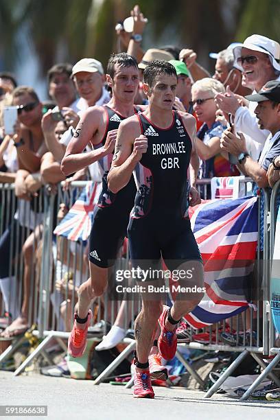 Alistair Brownlee and Jonathan Brownlee of Great Britain compete during the Men's Triathlon at Fort Copacabana on Day 13 of the 2016 Rio Olympic...