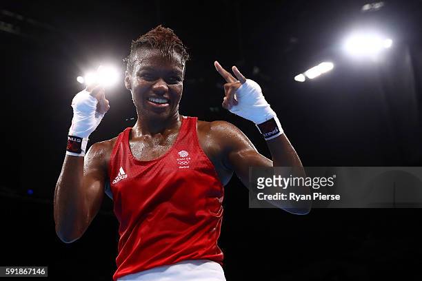 Nicola Adams of Great Britain celebrates after defeating Cancan Ren of China during a Women's Fly Semifinal bout on Day 13 of the 2016 Rio Olympic...
