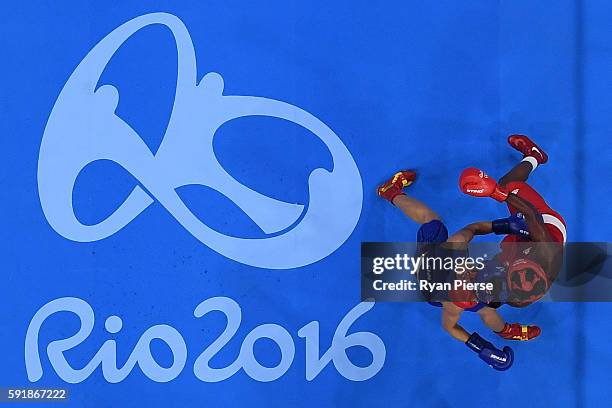 Nicola Adams of Great Britain fights against Cancan Ren of China during a Women's Fly Semifinal bout on Day 13 of the 2016 Rio Olympic Games at...