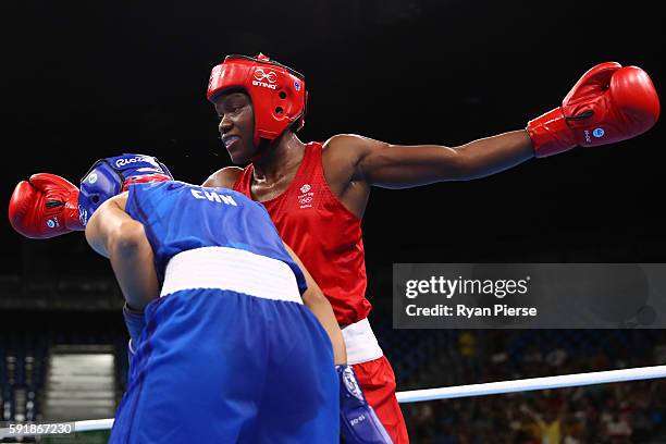 Nicola Adams of Great Britain fights against Cancan Ren of China during a Women's Fly Semifinal bout on Day 13 of the 2016 Rio Olympic Games at...