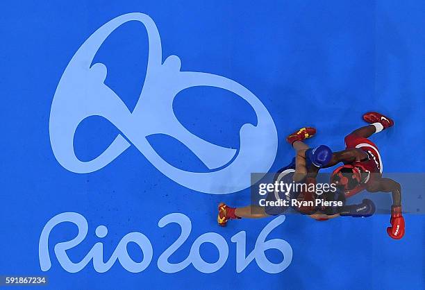 Nicola Adams of Great Britain fights against Cancan Ren of China during a Women's Fly Semifinal bout on Day 13 of the 2016 Rio Olympic Games at...