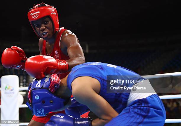 Nicola Adams of Great Britain fights against Cancan Ren of China during a Women's Fly Semifinal bout on Day 13 of the 2016 Rio Olympic Games at...