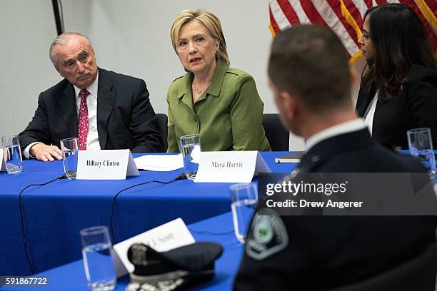 Bill Bratton, commissioner of the New York City Police Department, looks on as Democratic presidential candidate Hillary Clinton delivers opening...