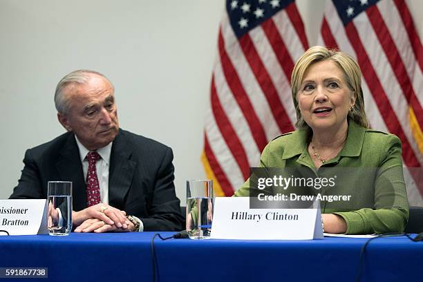 Bill Bratton, commissioner of the New York City Police Department, looks on as Democratic presidential candidate Hillary Clinton delivers opening...