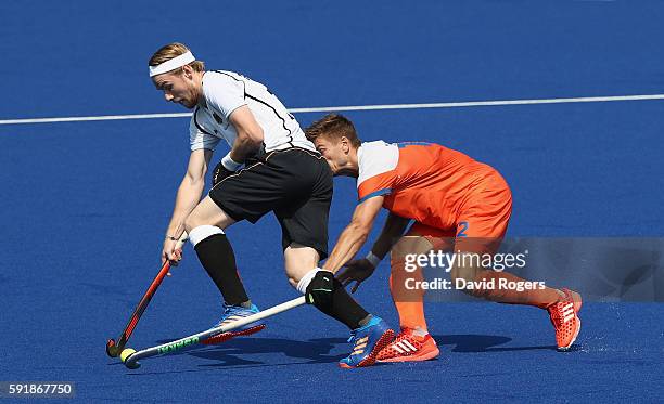 Christopher Ruhr of Germany is challenged by Sander de Wijn during the Men's Bronze Medal match between the Netherlands and Germany on Day 13 of the...