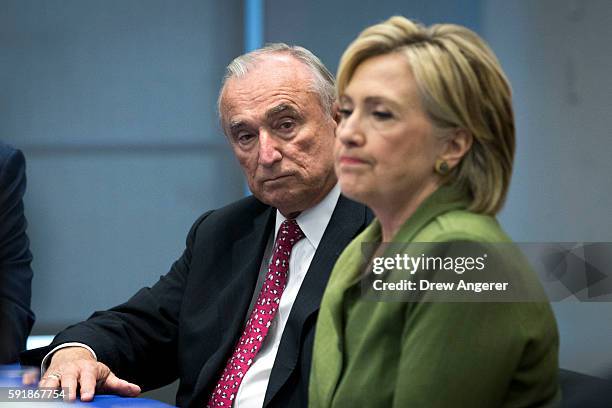 Bill Bratton, commissioner of the New York City Police Department, looks on as Democratic presidential candidate Hillary Clinton delivers opening...