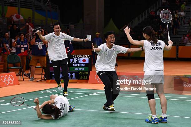 Misaki Matsutomo and Ayaka Takahashi of Japan celebrate winning match point against Christinna Pedersen and Kamilla Rytter Juhl of Denmark during the...