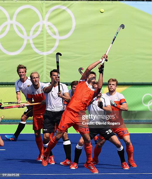 Sander de Wijn of the Netherlands reaches for the ball during the Men's Bronze Medal match between the Netherlands and Germany on Day 13 of the Rio...