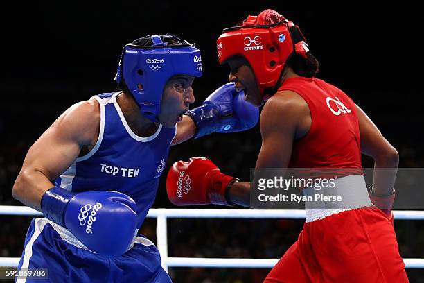 Ingrit Lorena Valencia Victoria of Colombia fights against Sarah Ourahmoune of France during a Women's Fly Semifinal bout on Day 13 of the 2016 Rio...