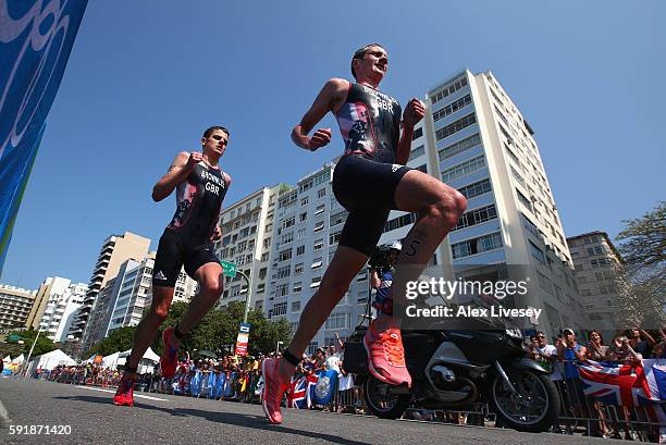 Alistair Brownlee and Jonathan Brownlee of Great Britain compete during the Men's Triathlon at Fort Copacabana on Day 13 of the 2016 Rio Olympic...