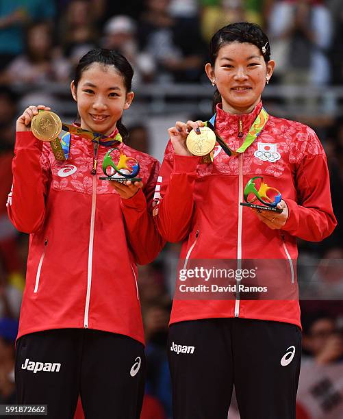 Gold medalists Misaki Matsutomo and Ayaka Takahashi of Japan pose on the podium during the medal ceremony for the Women's Doubles Badminton on Day 13...