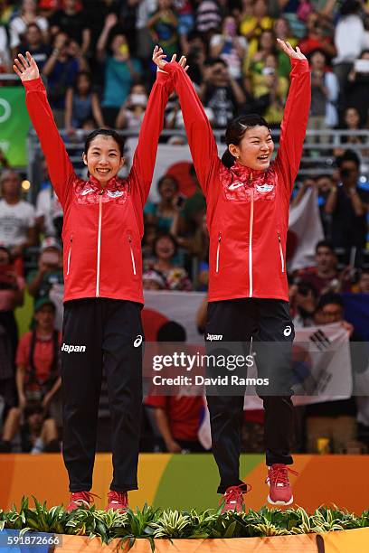 Gold medalists Misaki Matsutomo and Ayaka Takahashi of Japan pose on the podium during the medal ceremony for the Women's Doubles Badminton on Day 13...