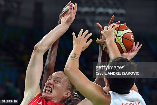 Serbia's power forward Danielle Page and Spain's power forward Laura Nicholls go for a rebound during a Women's semifinal basketball match between...