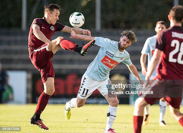 Josef Sural of Sparta Prag and Johan Absalonsen of Soenderjyske vie for the ball during the UEFA Europa League Play-Off first leg match SoenderjyskE...