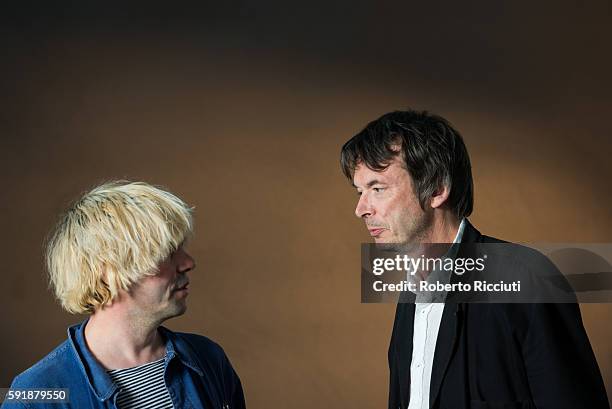 English singer-songwriter Tim Burgess and Scottish writer Ian Rankin attend a photocall at Edinburgh International Book Festival at Charlotte Square...