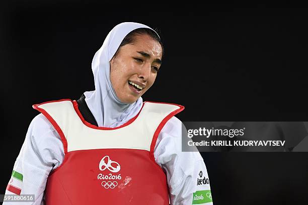 Iran's Kimia Alizadeh Zenoorin reacts after losing to Spain's Eva Calvo Gomez in their womens taekwondo quarter-final bout in the -57kg category as...