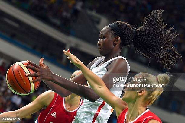 Spain's power forward Astou Ndour and Serbia's point guard Milica Dabovic go for a rebound during a Women's semifinal basketball match between Spain...