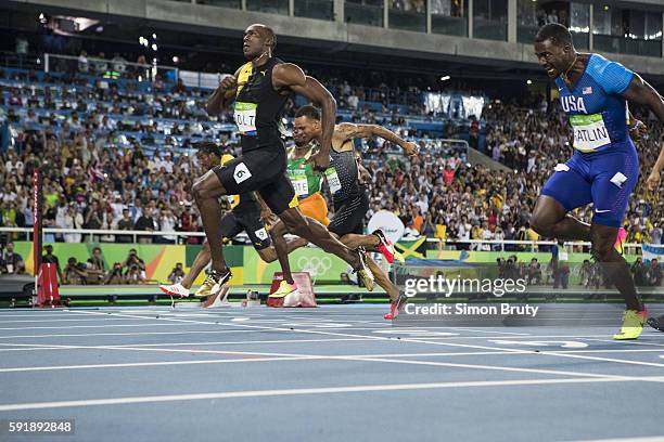 Summer Olympics: Jamaica Usain Bolt and USA Justin Gatlin in action during Mens 100M Final at Rio Olympic Stadium. Bolt wins gold. Gatlin wins...