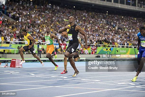 Summer Olympics: Jamaica Usain Bolt and USA Justin Gatlin in action during Mens 100M Final at Rio Olympic Stadium. Bolt wins gold. Gatlin wins...