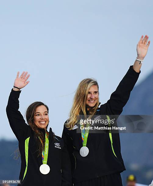 Alex Maloney of New Zealand and Molly Meech of New Zealand celebrate winning the silver medal in the Women's 49er FX class medal race at the Marina...