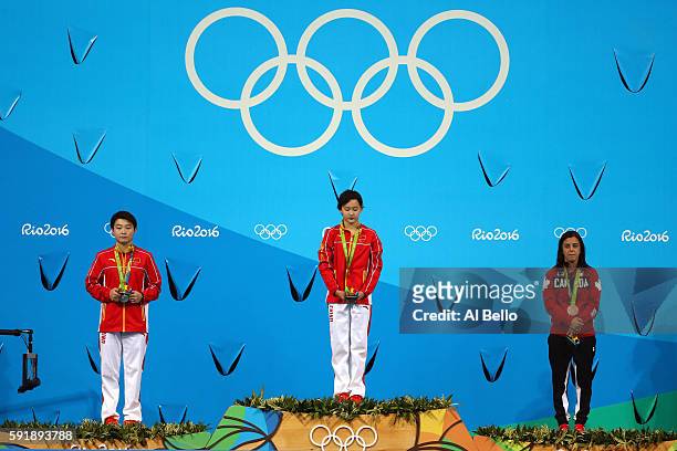 Silver medalist Yajie Si of China, gold medalist Qian Ren of China and bronze medalist Meaghan Benfeito of Canada stand on the podium during the...