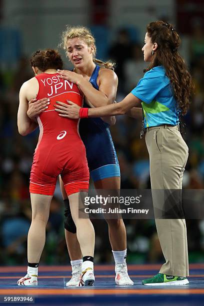 Helen Louise Maroulis of the United States consoles Saori Yoshida of Japan after defeating her in the Women's Freestyle 53 kg Gold medal match on Day...