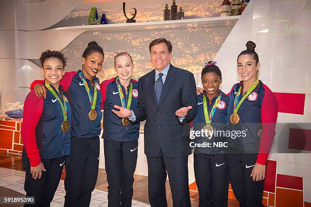 Pictured: Bob Costas poses with U.S. Gymnasts Laurie Hernandez, Gabby Douglas, Madison Kocian, Simone Biles, and Aly Raisman on August 9, 2016 --