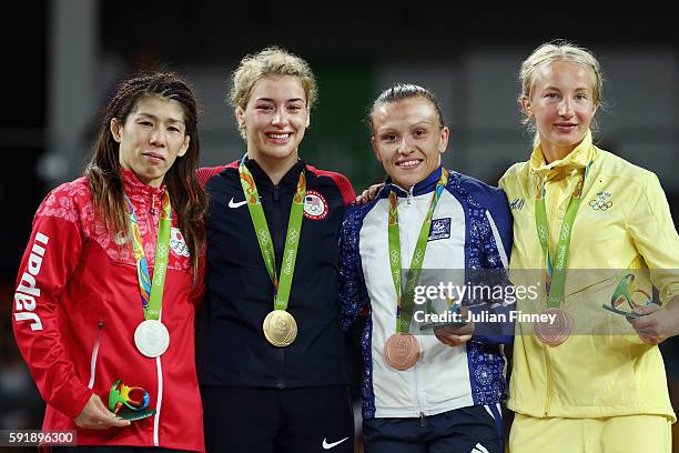 Silver medalist Saori Yoshida of Japan, gold medalist Helen Louise Maroulis of the United States, bronze medalist Natalya Sinishin of Azerbaijan and...